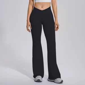 Detail view of women crossover waist flare yoga pants, high waist tummy control sportswear.