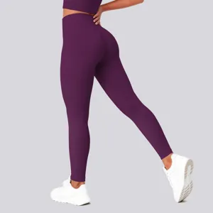 Detail shot showing high-waisted purple yoga leggings with butt-lifting fit during movement.