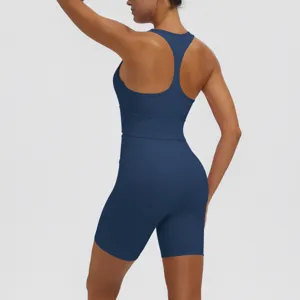 Women solid color athletic yoga set featuring a racerback sports bra and high waist shorts.