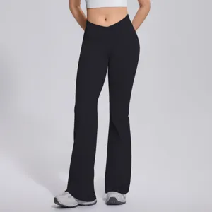 Detail view of black crossover waist flared yoga pants, high stretch fitness gym trousers.