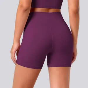 Back view detail of high-waisted purple yoga shorts showing shaping seams and stretchy fit.