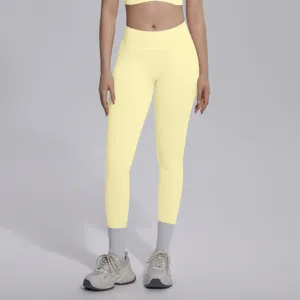 Seamless high V-waist knit yoga leggings detail, breathable solid yellow athletic activewear.