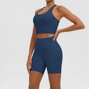 Solid dark blue yoga set for women, breathable fitness workout bra and high waist shorts.