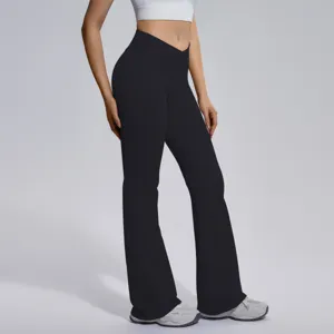 Detailed view of women's high-waist crossover flare yoga pants, showcasing elastic fit.