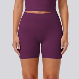 High-waist tight yoga shorts detail shot, breathable naked-feel stretchy fitness running activewear.