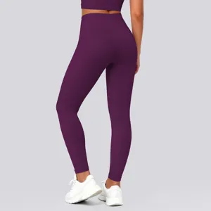 High-waisted seamless purple yoga leggings detail showing back fit and athletic style comfort.