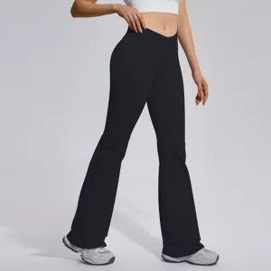 Detail view of high-waist crossover flare yoga pants showing tummy control stretch fit.