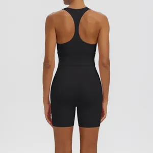 Back view of black women's athletic backless yoga jumpsuit, breathable fitness activewear.