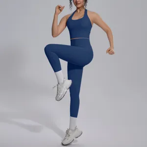 Blauwe effen tweedelige yogaset met halter sportbeha en hoge taille leggings voor fitness.
