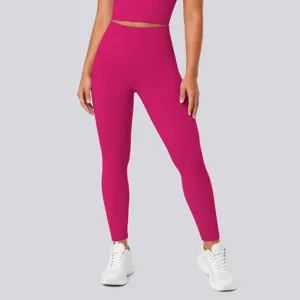 Detailed view of women's high-waisted fitness leggings in bright pink, smooth texture.