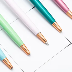 Colorful metal ballpoint pens with rose gold trim, sleek design for business gifts and office use.