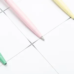 Colorful ballpoint pens set with minimalist pastel design, smooth writing metal tips for office use.