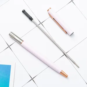 Pink metal ballpoint pen with rose gold trim, elegant business stationery for office use.