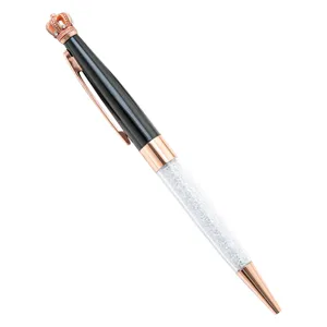 Elegant crystal crown ballpoint pen with black barrel and rose gold accents for office use.