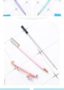 Metal diamond ballpoint pen detail showcasing the colorful metal barrel, crystal cap and refill.