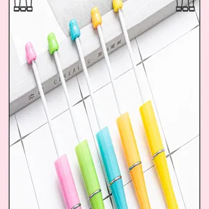 Detailed view of creative DIY colorful beaded ballpoint pens with charming pastel design.