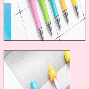 Detailed close-up view of colorful DIY beadable plastic pens and student stationery items.