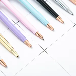 Colorful metal ballpoint pens set with rose gold tips, elegant writing stationery for gifts.