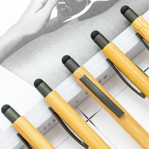 Bamboo stylus pen with smooth wooden barrel, metal clip and sensitive touch tip for office use.