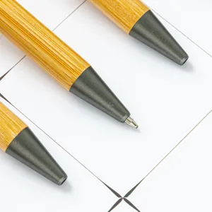 Eco-friendly bamboo ballpoint pen with metal tip, ideal for office and custom logo print.
