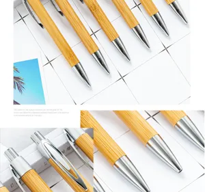 Natural bamboo ballpoint pen with metal clip, eco-friendly click pen for business gifts.