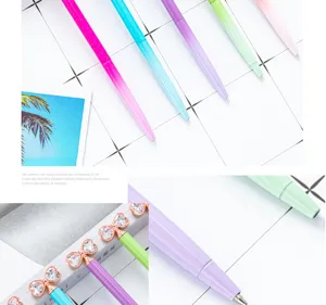 Gradient glitter ballpoint pens with crystal bow tops, cute metal styling school stationery.