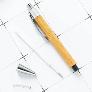 Eco-friendly bamboo ballpoint pen with metal trim, push design, perfect custom corporate gift.