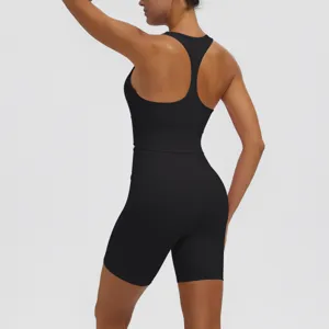 Black ribbed seamless activewear set for women, breathable yoga top and biker shorts.