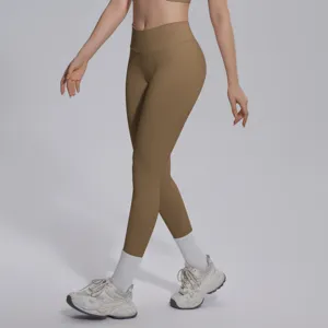 Seamless knit solid brown high-waist V-waist tight breathable yoga pants detail view.