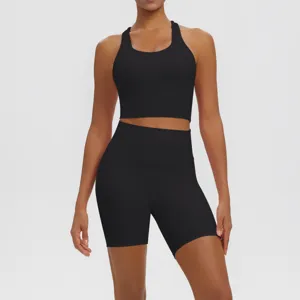 Detailed view of the black sports bra and high-waisted biker shorts activewear set.
