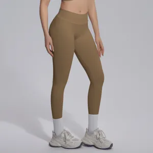 Detail shot of high-waist seamless knit yoga leggings in solid khaki, breathable and shaping.