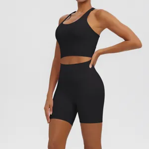 Close-up detail of black athletic yoga set featuring breathable fabric and seamless back design.