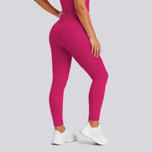 High-waist pink fitness leggings back detail, seamless shaping stretch activewear yoga pants.