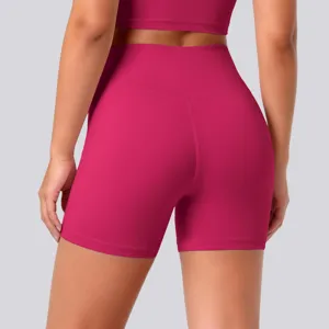 High-waist athletic yoga shorts in rose red, showing rear view detail and stretchy fit.