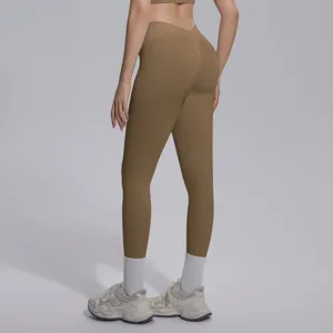 Detailed back view of seamless knitted khaki V-waist fitness leggings showing hip-lifting curve.