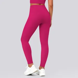 Detailed rear view of high waist bright pink yoga pants showing lift and tight athletic fit.