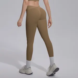 Seamless knit solid color V-waist tight butt lifting yoga pants for fitness and running.