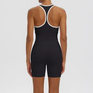 Detail view showing the breathable racerback design and fit of the black athletic top.