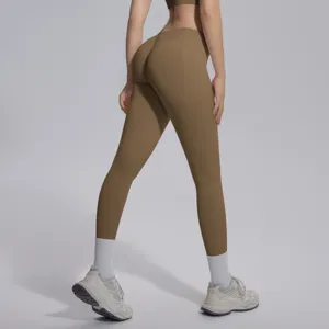 Detail view of brown seamless high-waist fitness yoga leggings showcasing hip lift design.
