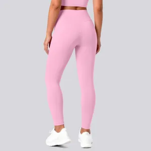 Back view detail of pink high waist fitness leggings and crop top, athletic wear close up.