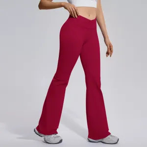 Detailed view of women high waist crossover flare yoga pants in wine red active wear style