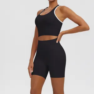 Detailed view of the black breathable sports bra and shorts set with stylish white trim.