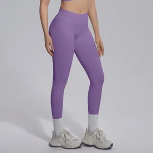 Detail view of purple seamless high waist yoga leggings, stretchy breathable workout pants gym.