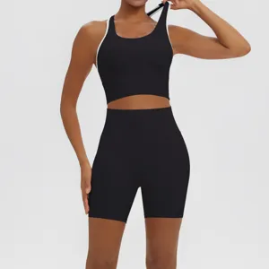 Detail shot of black activewear set featuring a sports bra and high waist shorts.