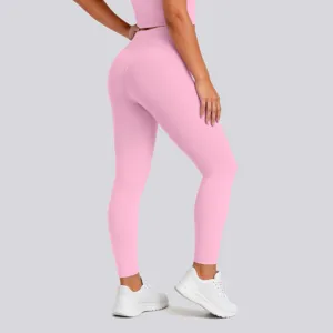 Pink high-waisted yoga leggings detail view, featuring elastic fabric and butt lift design.