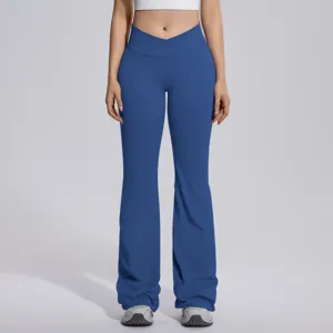 Close-up detail of crossover waist flare yoga pants in blue, high elasticity fabric.