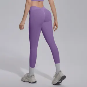 Seamless knit solid color V-waist tight breathable butt lifting yoga pants for fitness.
