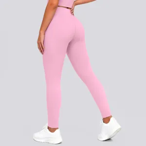 Detailed view of high-waisted pink yoga pants showing stretchy fabric and butt-lifting fit.