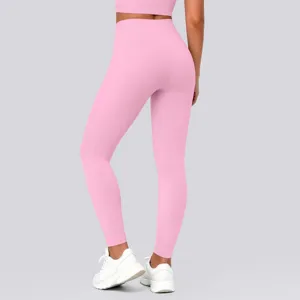 Pink high waisted yoga leggings detail view, seamless stretch fitness workout pants for women.