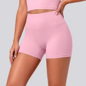 High-waist pink athletic yoga shorts paired with matching crop top for gym fitness running.